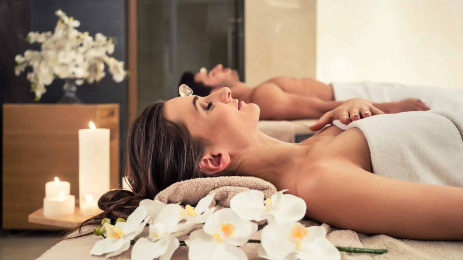 Young,Man,Relaxing,With,His,Partner,On,Massage,Beds,At