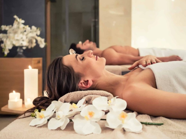 Young,Man,Relaxing,With,His,Partner,On,Massage,Beds,At